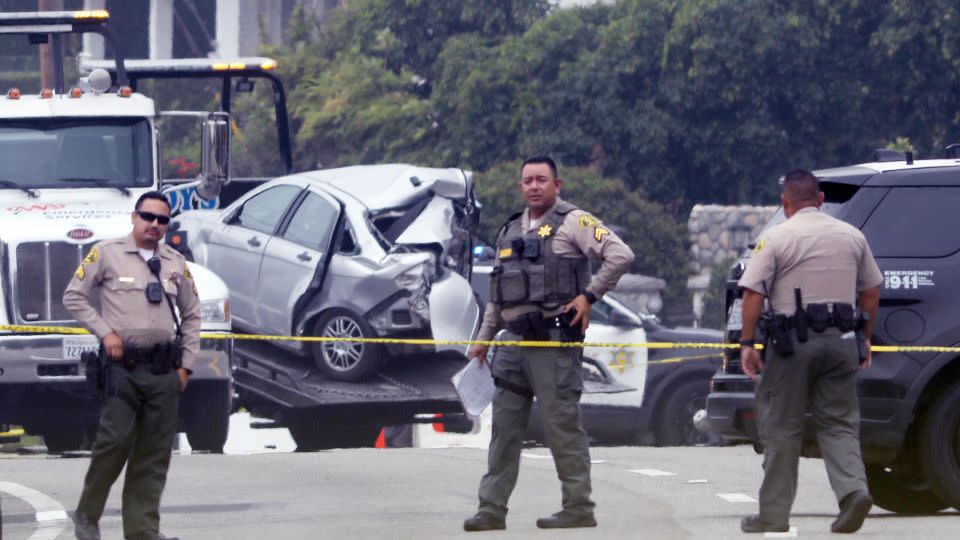 Sheriff deputies monitor the scene where four Pepperdine students were killed in a multi-vehicle crash in Malibu on October 18, 2023. - Genaro Molina/Los Angeles Times/Getty Images