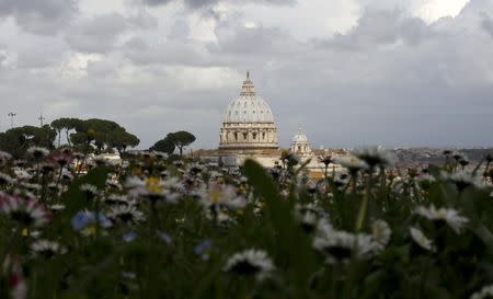 Saint Peter's Basilica at the Vatican is seen from a hilltop in Rome, March 11, 2013. REUTERS/Paul Hanna/Files