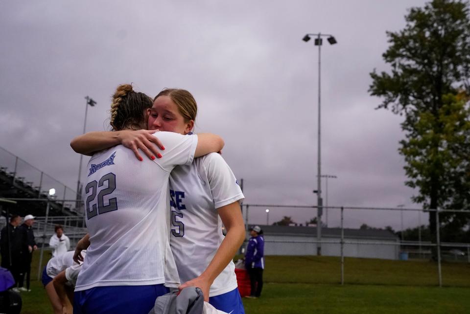 Hamilton Southeastern Royals Alyssa Damson (15) hugs Hamilton Southeastern Royals defender Abby Straus (22) Thursday, Oct. 5, 2023, after the IHSAA sectional semifinals at Hamilton Southeastern High School in Indianapolis. The Noblesville Millers defeated the Hamilton Southeastern Royals, 2-1.