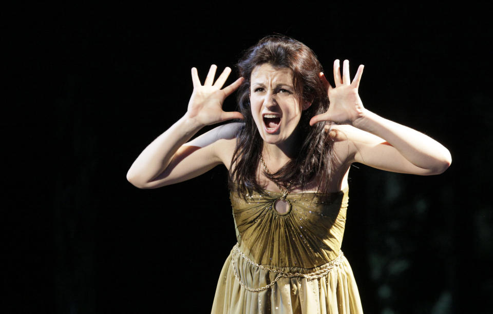 In this picture taken Wednesday, May 23, 2012, Irina Lungu in the role of Violetta Valery performs during a dress rehearsal at the Theater an der Wien in Vienna, Austria, for the opera "La Traviata" by Giuseppe Verdi. (AP Photo/dapd, Lilli Strauss)