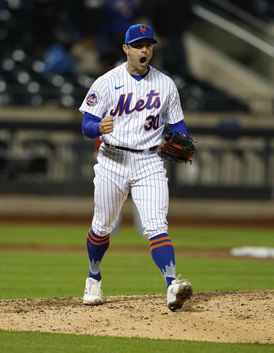 New York Mets relief pitcher David Robertson (30) reacts after the final out against the Washington Nationals during the ninth inning of a baseball game, Thursday, April 27, 2023, in New York. The New York Mets won 9-8. (AP Photo/Noah K. Murray)