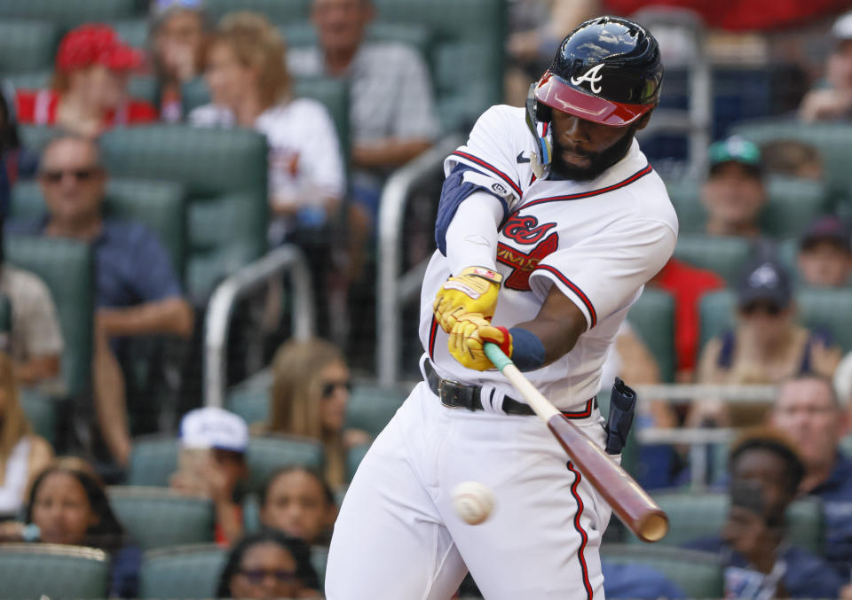 Atlanta Braves' Michael Harris II, making his major-league debut, hits his first major league hit in the sixth inning, a single, and proceeded to score the Braves' only run of a baseball game against the Miami Marlins, Saturday, May 28, 2022, in Atlanta. (AP Photo/Bob Andres)