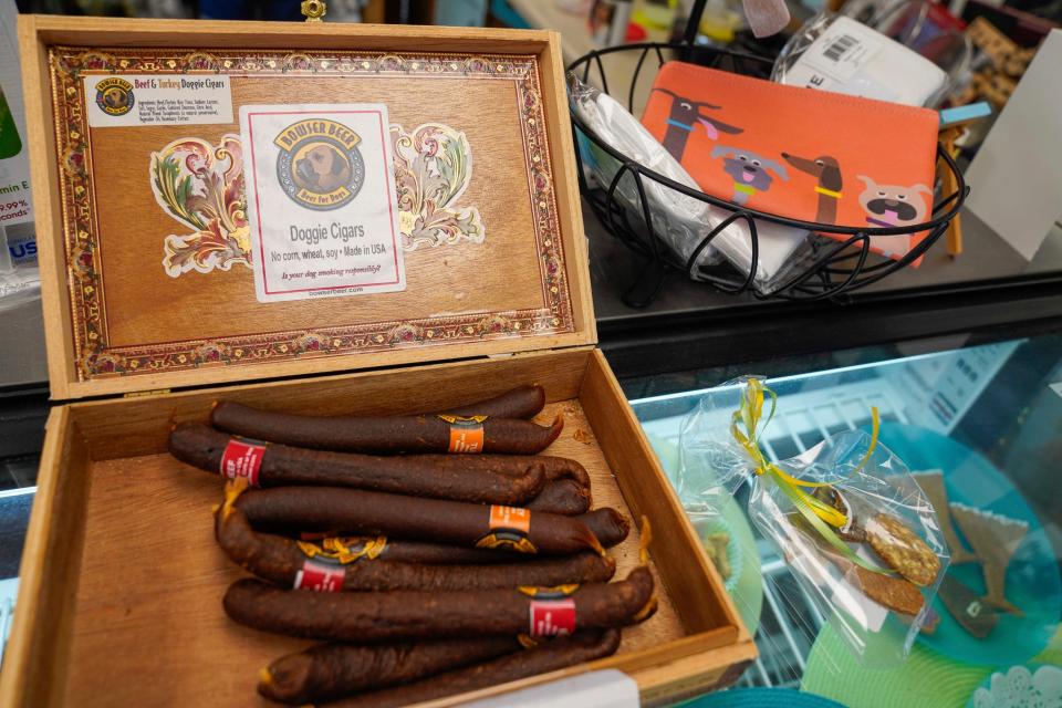 Doggie Cigars for sale at Bow Wow Baketique in Grosse Pointe on Friday, July 14, 2023. Owner Lisa Bardy, 53, sells a package gift with a doggy cigar and a doggy beer for dogs' third birthday, which would be 21 in human years.