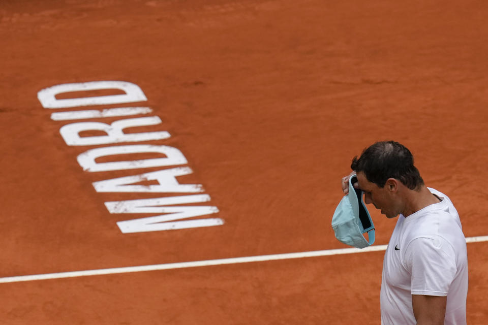 Spain's Rafael Nadal adjuts his cap during a training session at the Mutua Madrid Open tennis tournament in Madrid, Spain, Thursday, April 28, 2022. (AP Photo/Manu Fernandez)