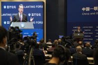 Chinese Foreign Minister Wang Yi speaks during a symposium to mark the 50th anniversary of the People's Republic of China's entry into the U.N. at the Foreign Ministry in Beijing on Friday, June 25, 2021. Foreign Minister Wang Yi said China remains deeply committed to United Nations peacekeeping efforts, where more than 2,400 Chinese troops and police are serving, a contribution that underscores China's increasing prominence in the world body. (AP Photo/Ng Han Guan)