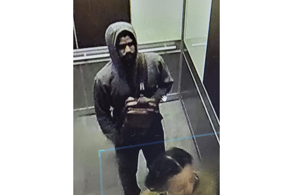 This photo released by the Atlanta Police Department of video footage on Wednesday, May 3, 2023, shows a suspected shooter. Police said Wednesday afternoon that they were investigating an “active shooter situation” in a building in Atlanta's Midtown neighborhood and that multiple people had been injured. (Atlanta Police Department via AP)