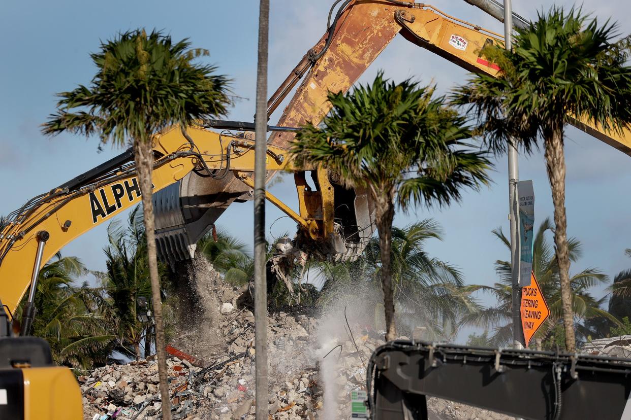 Excavating machinery continues to dig through the ruins of the partially collapsed 12-story Champlain Towers South condo building on July 15, 2021 in Surfside, Florida. 