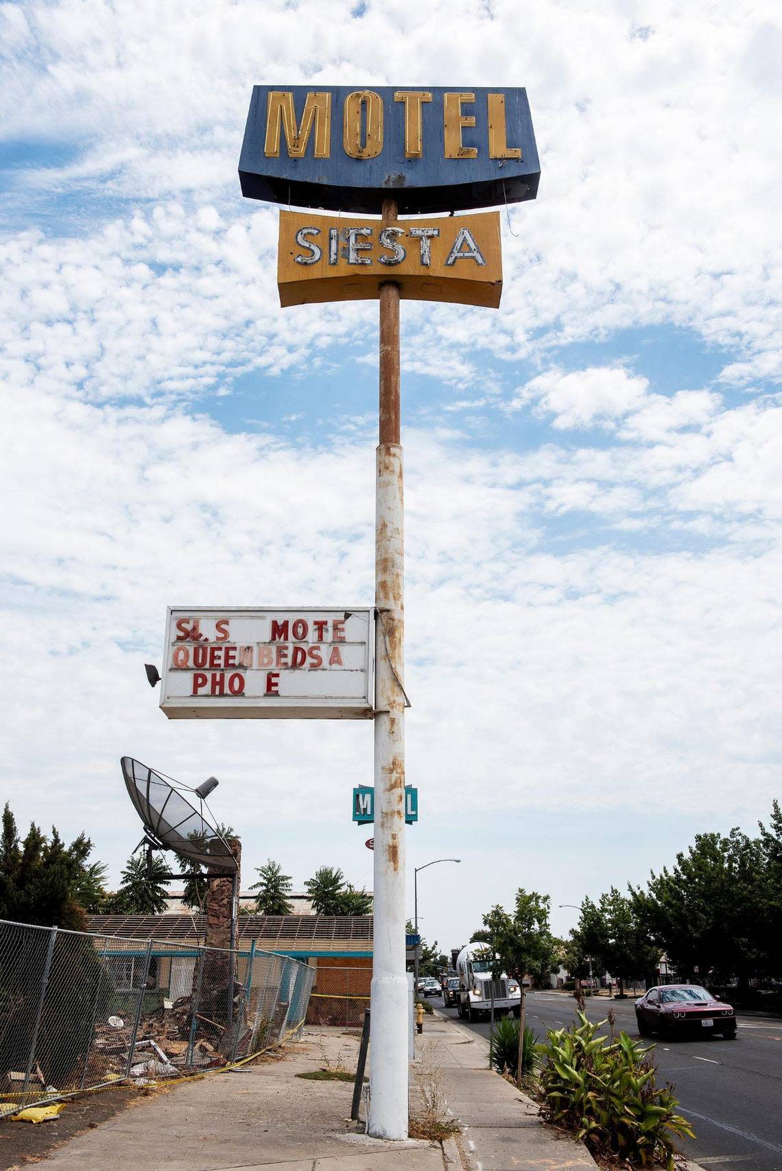 The Siesta Motel sign at at 1347 W. 16th Street, as the motel buildings are demolished in Merced, Calif., on Thursday, Aug. 4, 2022.