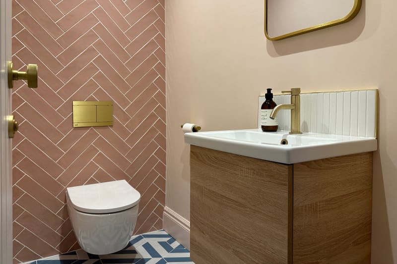 Wooden vanity in newly remodeled bathroom.