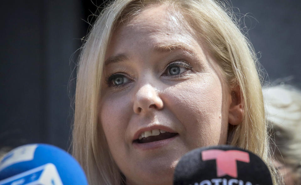 FILE - Virginia Roberts Giuffre speaks during a press conference outside a Manhattan court in New York, Aug. 27, 2019. When Jeffrey Epstein’s longtime companion Ghislaine Maxwell goes on trial next week, the accuser who captivated the public most, with claims she was trafficked to Britain’s Prince Andrew and other prominent men, won’t be part of the case. U.S. prosecutors chose not to bring charges in connection with Virginia Giuffre, who says Epstein and Maxwell flew her around the world when she was 17 and 18 for sexual encounters with billionaires, politicians, royals and heads of state. (AP Photo/Bebeto Matthews, File)