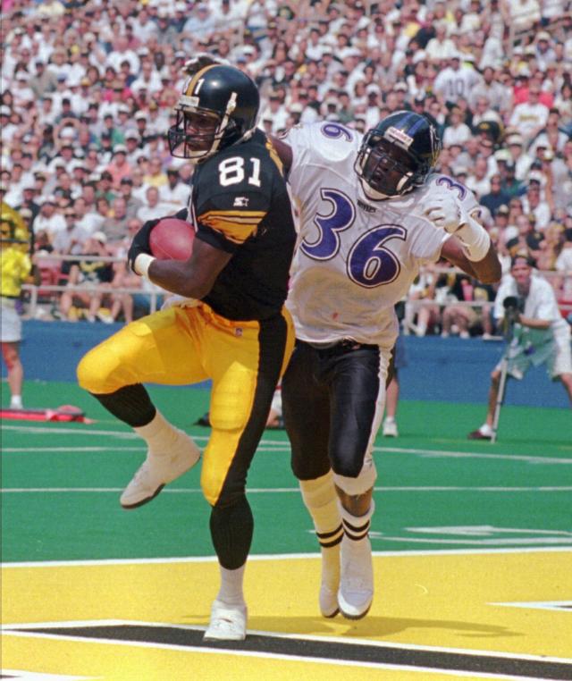 Charles Johnson (81), who played for the Pittsburgh Steelers from 1994-98, catches a touchdown pass as Baltimore Ravens Isaac Booth defends during a Sept. 8, 1996 game.