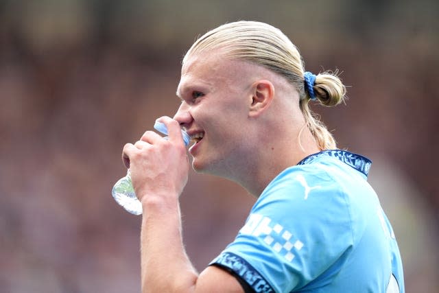 Erling Haaland refreshes during a drinks break