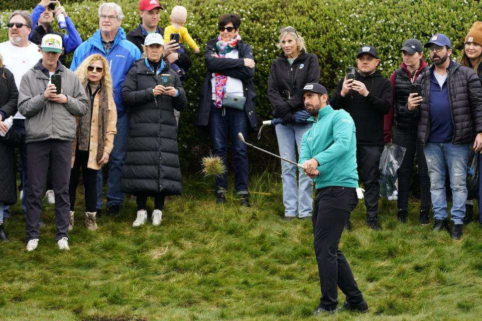 Matthieu Pavon hits his chip shot on the fifth hole during the third round of the AT&T Pebble Beach Pro-Am golf tournament at Pebble Beach Golf Links. Mandatory Credit: Michael Madrid-USA TODAY Sports