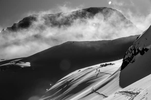 Chad Sayers and Riley Leboe work their way towards the next line as the morning clouds burnt off, revealing this incredible beauty to us.<p>Photo: Guy Fattal</p>