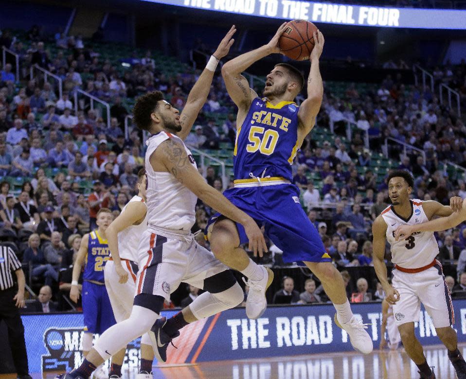 South Dakota State guard Michael Orris (50) goes to the basket as Gonzaga guard Josh Perkins (13) defends during the first half of a first-round men's college basketball game in the NCAA Tournament Thursday, March 16, 2017, in Salt Lake City. (AP Photo/Rick Bowmer)