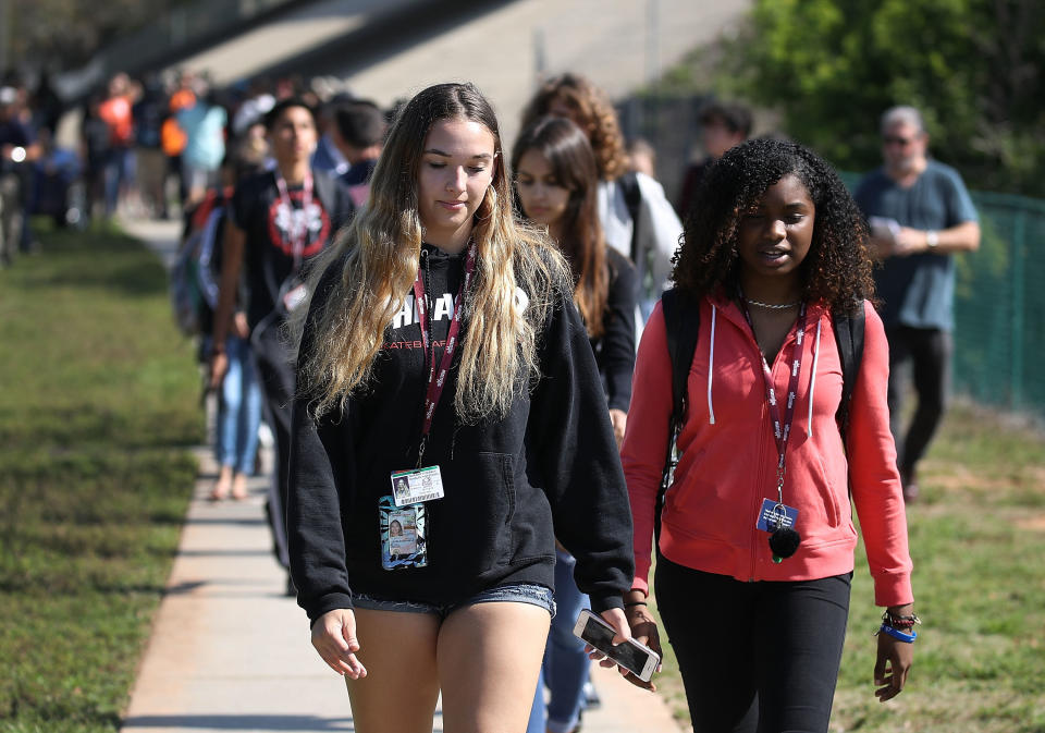 Students from Marjory Stoneman Douglas High School, where 17 people were killed during a mass shooting earlier this year, leave school together for the National School Walkout.