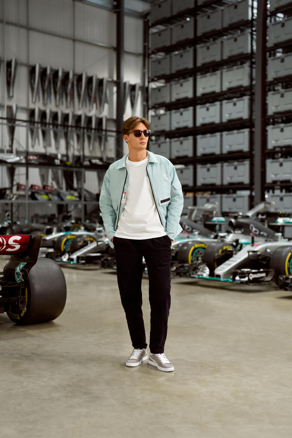 George Russell wearing a look from the Mercedes-AMG Petronas F1 Team x Puma x Raeburn collection