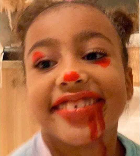 North West showing off her Pennywise themed makeup 