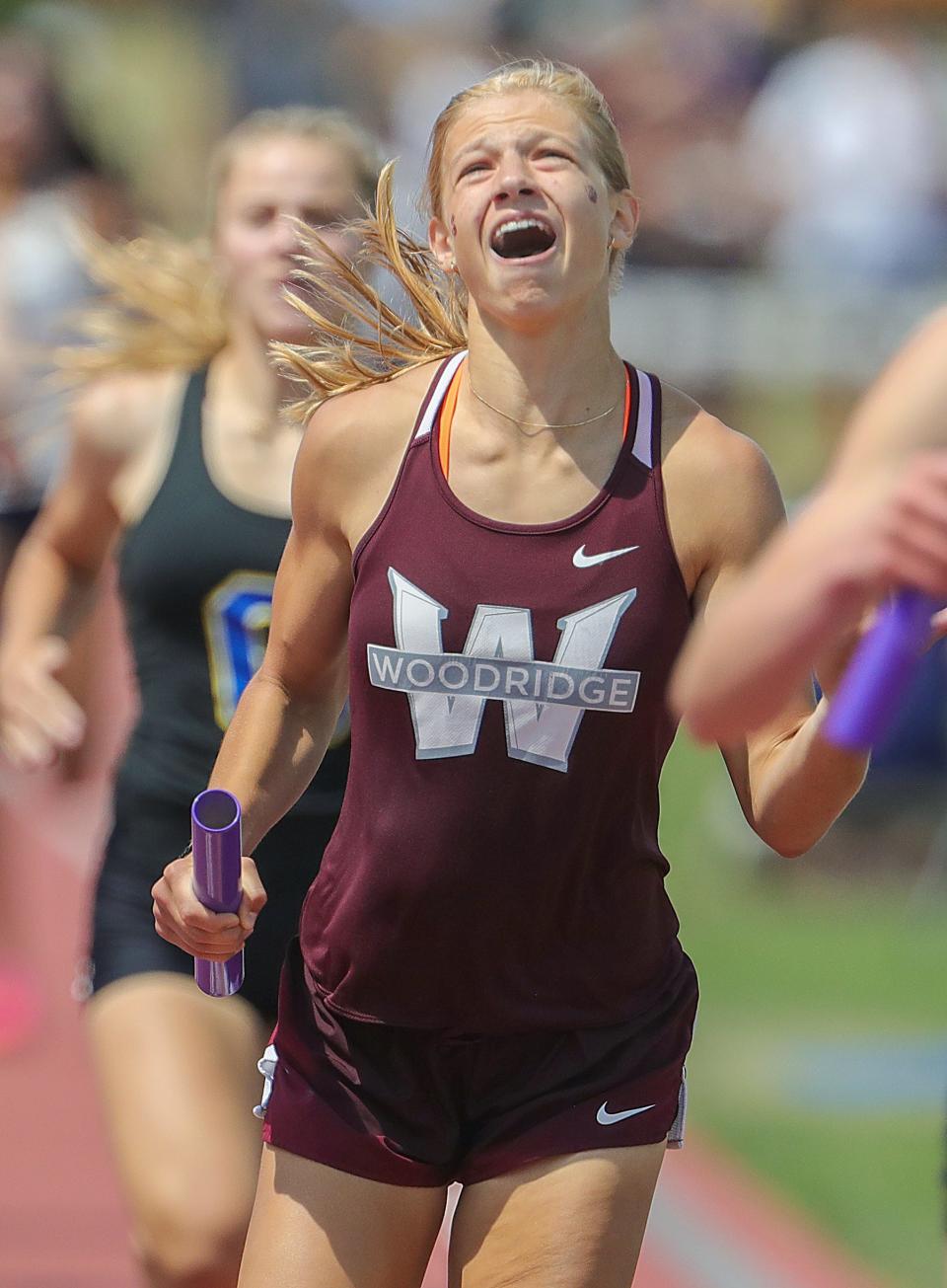 Woodridge's Reese Reaman reacts after clinching team state title in the 1,600-meter relay at 2023 state meet.