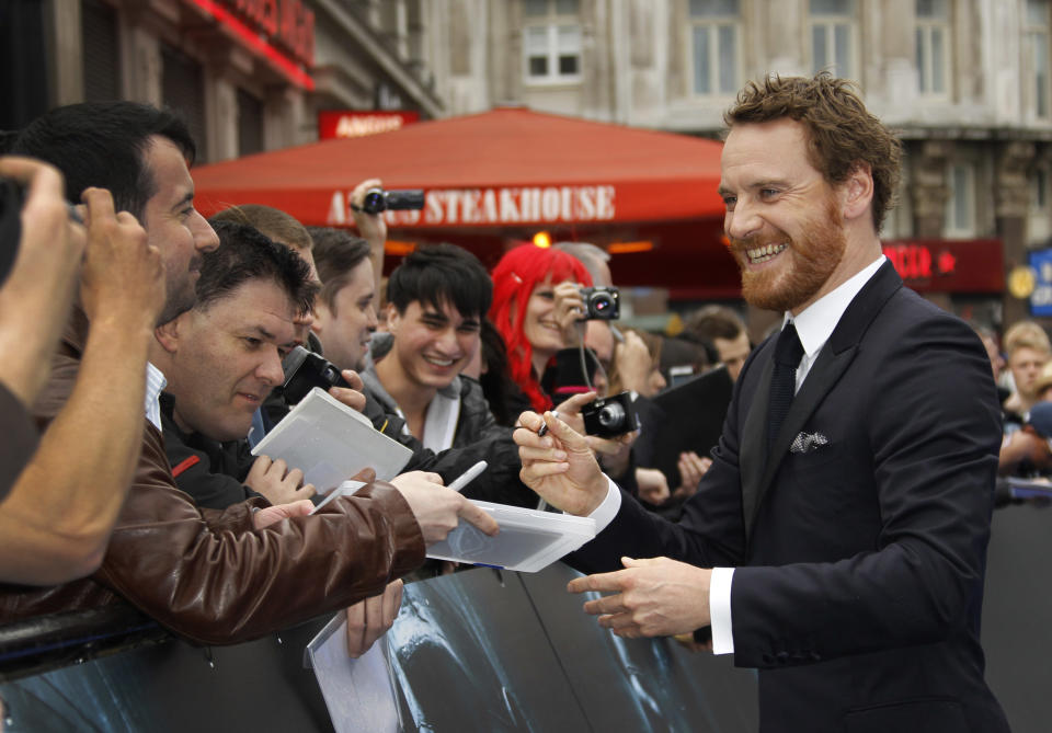 Actor Michael Fassbender smiles at fans as he arrives at a central London cinema for the World Premiere of Prometheus, Thursday, May 31, 2012. (AP Photo/Joel Ryan)