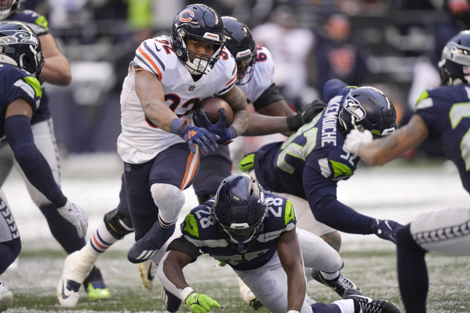 Chicago Bears running back David Montgomery carries against the Seattle Seahawks during the second half of an NFL football game, Sunday, Dec. 26, 2021, in Seattle. (AP Photo/Stephen Brashear)