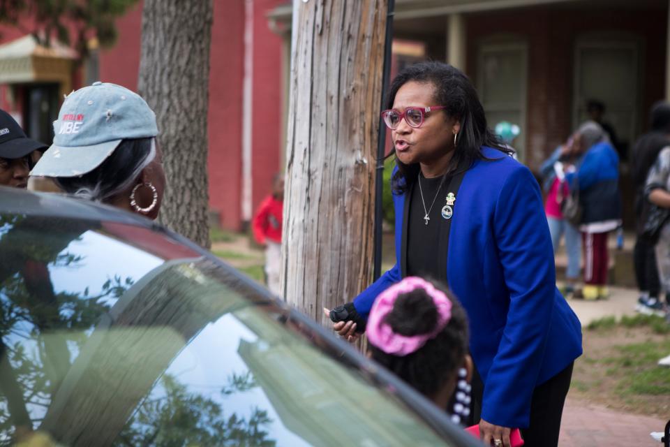 Delaware State Rep. Sherry Dorsey Walker speaks with residents who have been displaced on North Adams Street Monday, May 16, 2022. 