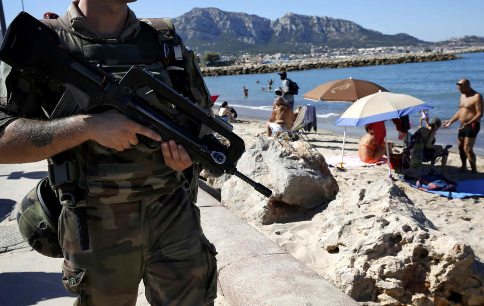 French soldiers patrol on the beach of Marseille