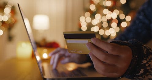 <span class="caption">As online shopping increases over the festive period, so does the risk of cyber-scams. </span> <span class="attribution"><a class="link " href="https://www.shutterstock.com/image-photo/merry-xmas-eve-online-shopping-store-2089436578" rel="nofollow noopener" target="_blank" data-ylk="slk:Chay Tee/Shutterstock;elm:context_link;itc:0;sec:content-canvas">Chay Tee/Shutterstock</a></span>