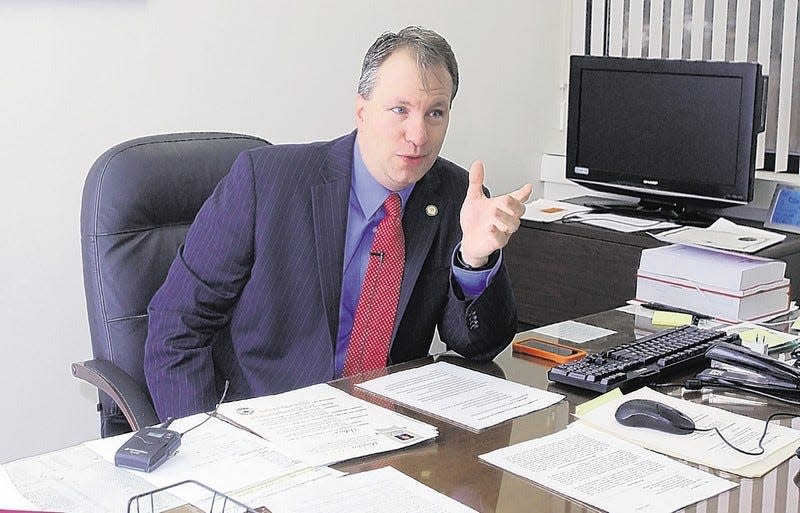 David Hoovler, the new Orange County district attorney, seen behind his desk on Feb. 2, 2014, said his office aims to boost community partnership.