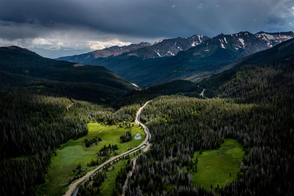 As the headwaters of the Colorado River flow out of the never summer mountains, the high meadows and alpine forests of the region are bathed in verdant new life. but here, human inference begins with the grand ditch, a 14-mile diversion that directs between 20 and 40 pe cent of the range’s annual snowpack out of the Colorado River and into eastern Colorado. | Spenser Heaps, Deseret News