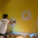 Perry called Bloom "dad of the year" as he painted daisies on their daughter's wall in an October 2021 Instagram video.
