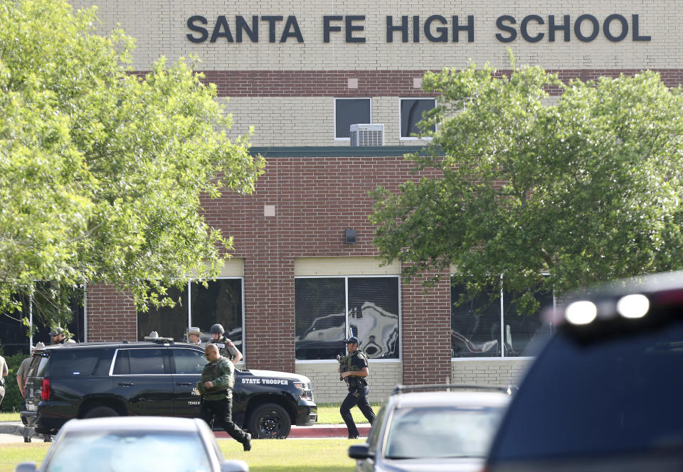 FILE - Law enforcement officers respond to Santa Fe High School after an active shooter was reported on campus in Santa Fe, Texas, May 18, 2018. An emotional audition on “American Idol” by Trey Louis, a survivor of a 2018 Texas high school shooting, prompted tears from the judges as well as criticism of the country’s response to gun violence. Louis was one of the students at Santa Fe High School in May 2018 when another student fatally shot 10 people on campus. (Steve Gonzales/Houston Chronicle via AP, File)