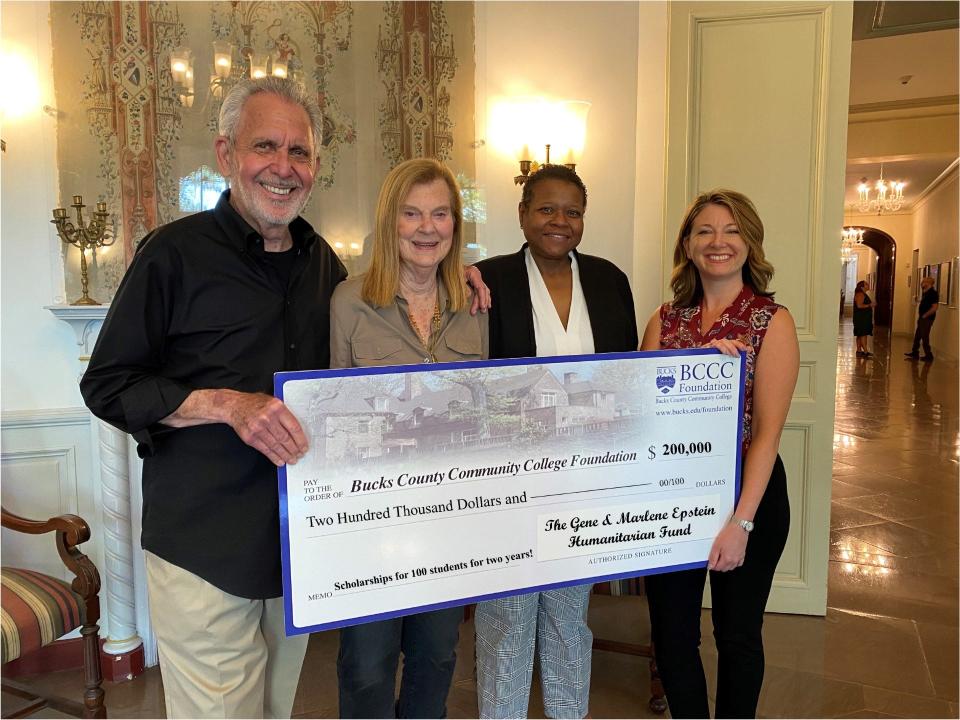 Philanthropists Gene and Marlene Epstein (left) present a check for $200,000 to Bucks County Community College President Felicia Ganther (center) and BCCC Foundation Executive Director Christina Kahmar to cover the costs of full scholarships for 100 students from Lower Bucks County. The presentations took place Thursday at Tyler Hall at the college's main campus in Newtown Township.