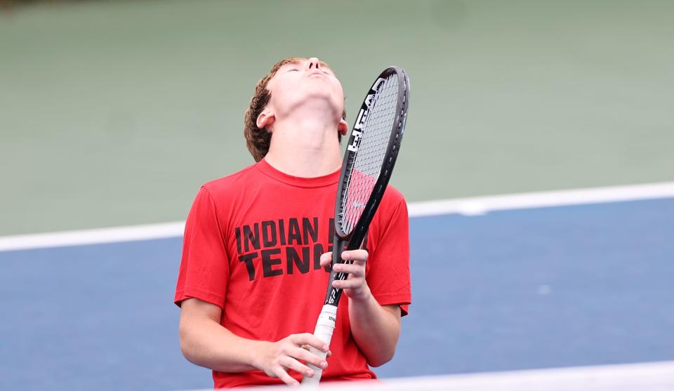 Indian Hill's R.J. Poffenberger reacts during their doubles match in the OHSAA state tennis tournament at the Lindner Family Tennis Center in Mason, Saturday, May 28, 2022.