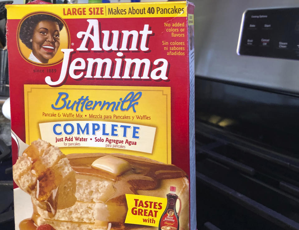 A box of Aunt Jemima pancake mix sits on a stovetop Wednesday, June 17, 2020, in Harrison, N.Y. Pepsico is changing the name and marketing image of its Aunt Jemima pancake mix and syrup, according to media reports. A spokeswoman for Pepsico-owned Quaker Oats Company told AdWeek that it recognized Aunt Jemima’s origins are based on a racial stereotype and that the 131-year-old name and image would be replaced on products and advertising by the fourth quarter of 2020. Quaker did not say what the name would be changed to. (AP Photo/Courtney Dittmar)