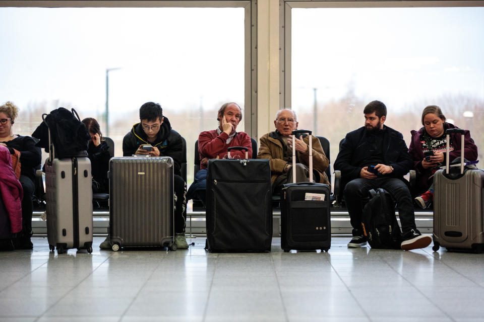 Passengers wait in the South Terminal building at London Gatwick Airport after flights resumed today on December 21 (Photo by Jack Taylor/Getty Images)