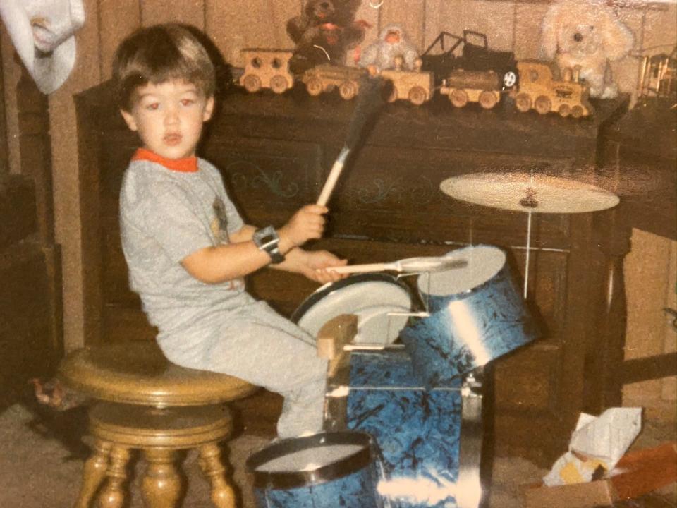 A young Jeff Schneeweis rocks out on his drum set. Now 40, the Christian music artist was nominated for two Grammy awards in November 2021 for his collaborative work.