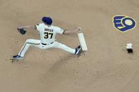 Milwaukee Brewers starting pitcher Adrian Houser throws during the first inning of a baseball game against the Atlanta Braves Tuesday, May 17, 2022, in Milwaukee. (AP Photo/Morry Gash)