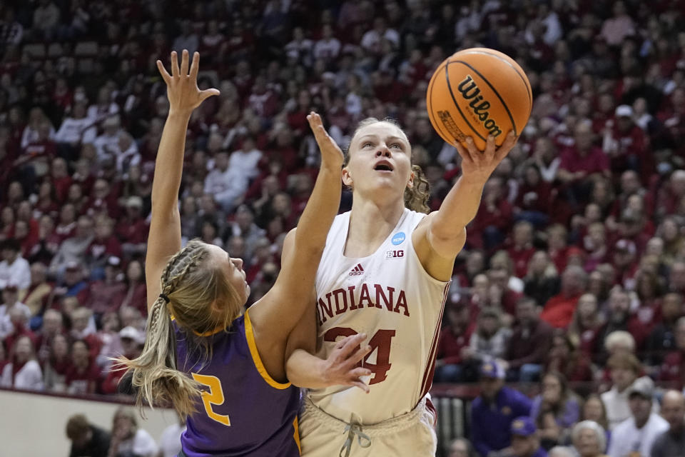 Indiana's Grace Berger (34) shoots against Tennessee Tech's Jordan Brock (2) during the first half of a first-round college basketball game in the women's NCAA Tournament Saturday, March 18, 2023, in Bloomington, Ind. (AP Photo/Darron Cummings)