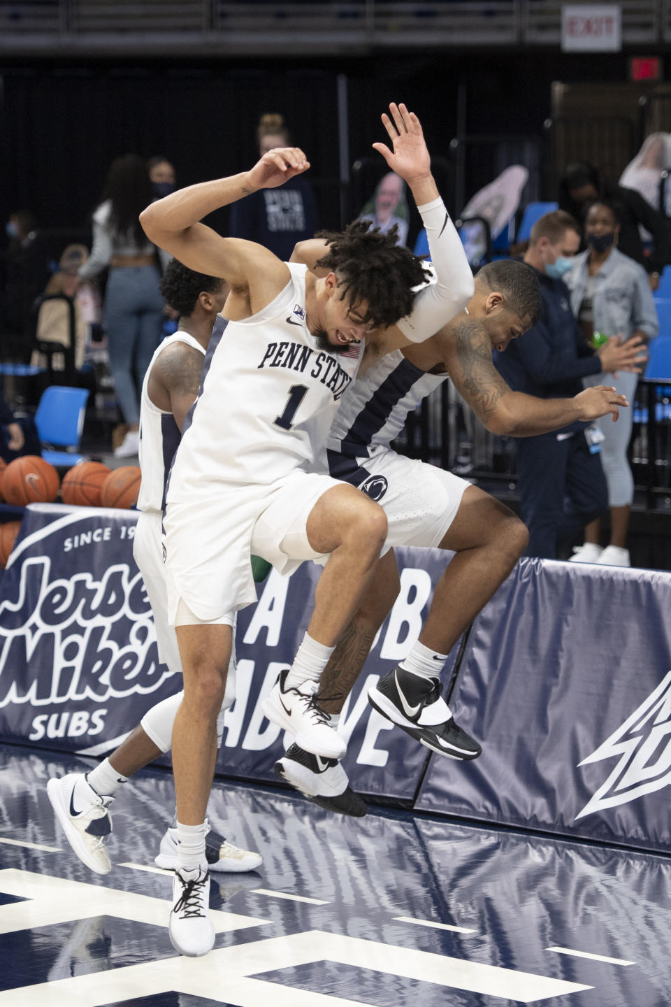 Penn State forward Seth Lundy (1) and guard Myles Dread (2) celebrate after the team's NCAA college basketball game against Minnesota on Wednesday, March 3, 2021, in State College, Pa. (Noah Riffe/Centre Daily Times via AP)