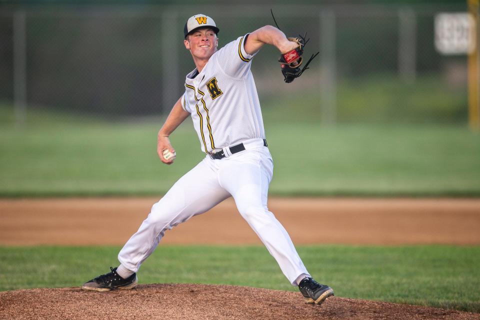 Winterset's Justin Hackett throws a pitch against Carroll on Tuesday at Winterset High School. Hackett, a TCU commit, has drawn interest from almost every MLB team.