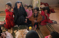 Syrian women and children react after arriving in the northern area of Deir al-Zor, Syria September 24,2017. REUTERS/ Rodi Said