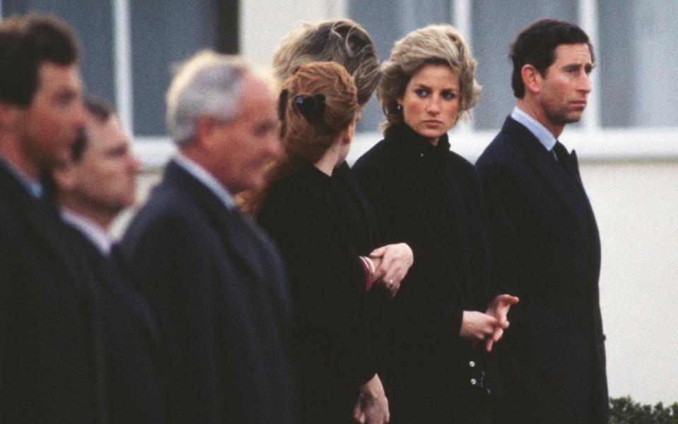 Sarah Ferguson, Duchess of York, Diana, Princess of Wales (1961-1997) and Prince Charles (L-R) on their arrival at RAF Northolt in London, accompanying the coffin of their friend Major Hugh Lindsay, in 1988 - Princess Diana Archive/Hulton Royals Collection