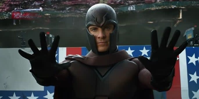 A young Magneto holding his palms out with a ruined stadium behind him in "X-Men: Days of Future Past"