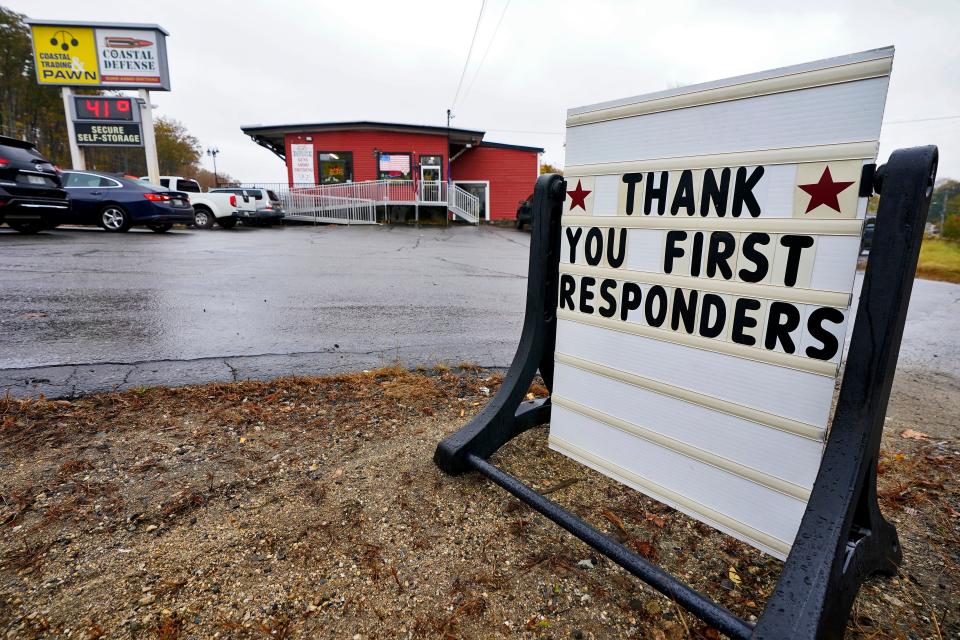 The Coastal Defense gun store, where Lewiston shooter Robert Card attempted to buy a silencer in August, is shown Oct. 30, 2023, in Auburn, Maine. Investigators are still searching for a motive for the massacre that claimed 18 lives as the community seeks a return to normalcy.