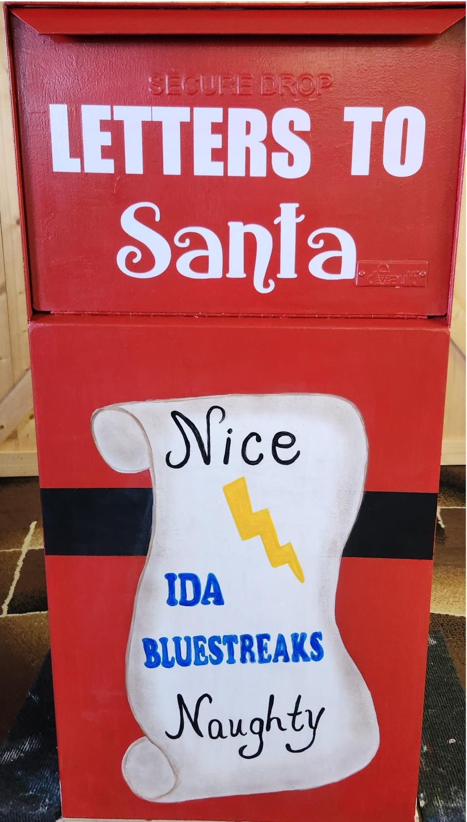Local painter and business owner Karen Lewis transformed the old ballot box into a Santa mailbox.
