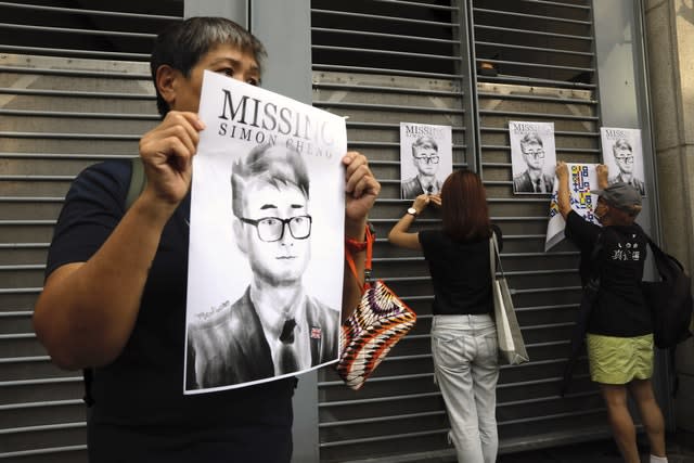 A supporter holds a poster outside the British Consulate in Hong Kong