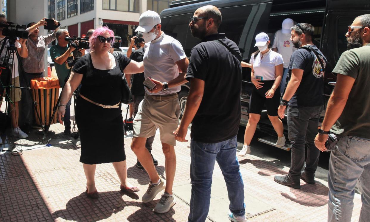 <span>Crew members of the vessel arrive at the court in Piraeus.</span><span>Photograph: Eurokinissi/Reuters</span>