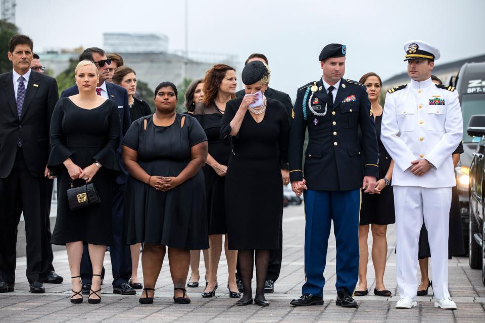 <p>The family of US Senator John McCain watches as a Military Honor Guard carries his casket from the U.S. Capitol in Washington, DC, on Sept. 1, 2018. (Photo by Jim Lo Scalzo/Pool/ AFP/Getty Images) </p>