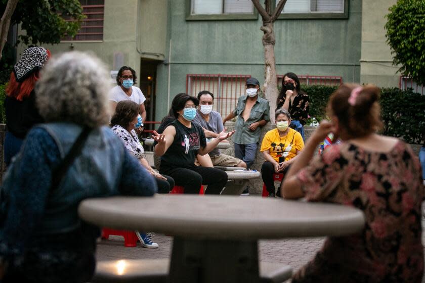 LOS ANGELES, CA - AUGUST 05: Residents of Hillside Villa attend a tenants association meeting where they discuss possible solutions to the rent increase under current their current landlord, Tom Botz on Thursday, Aug. 5, 2021 in Los Angeles, CA. (Jason Armond / Los Angeles Times)